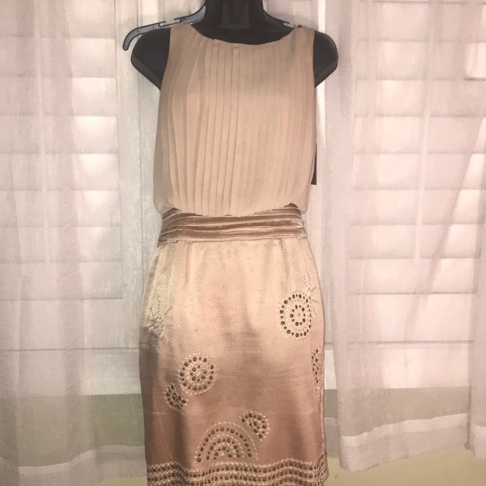 Beautiful tan Vince Camuto down with exotic design